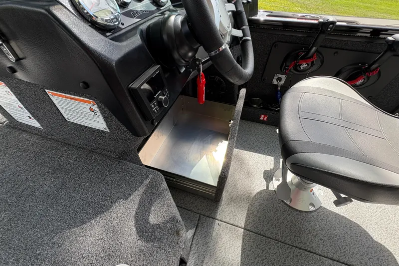 Slide: The Image of Interior of 2026 Lund 2075 Pro-V Sport boat, featuring steering wheel and seating. - 41
