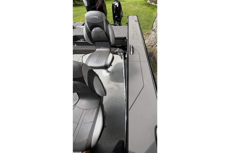 Slide: The Image of 2026 Lund 2075 Pro-V Sport boat interior with sleek seating and modern design. - 44