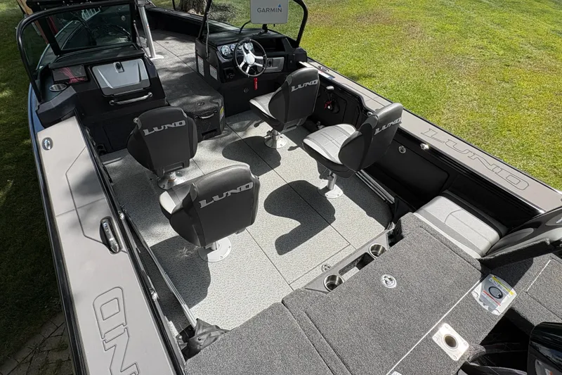 Slide: The Image of 2026 Lund 2075 Pro-V Sport boat interior with seating and steering console. - 45