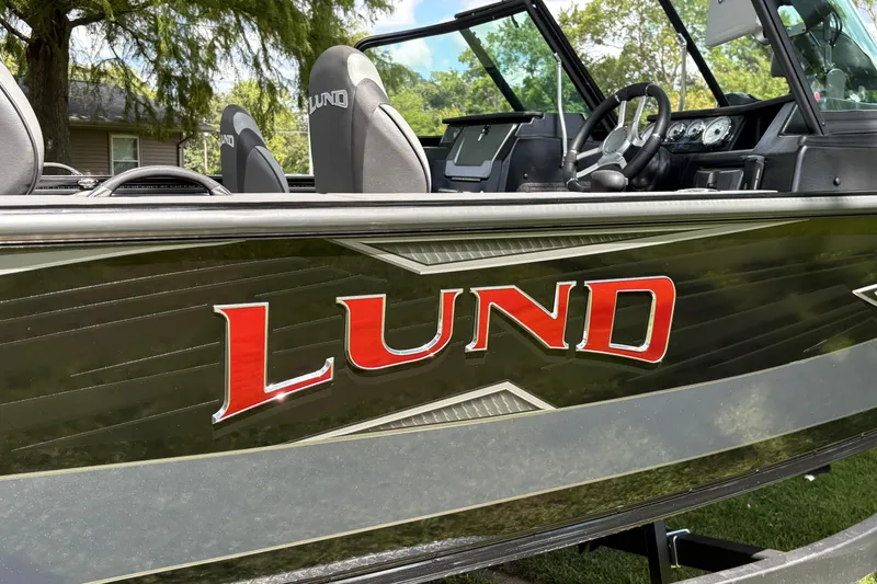 Slide: The Image of 2026 Lund 2075 Pro-V Sport boat with sleek design and visible interior details. - 50