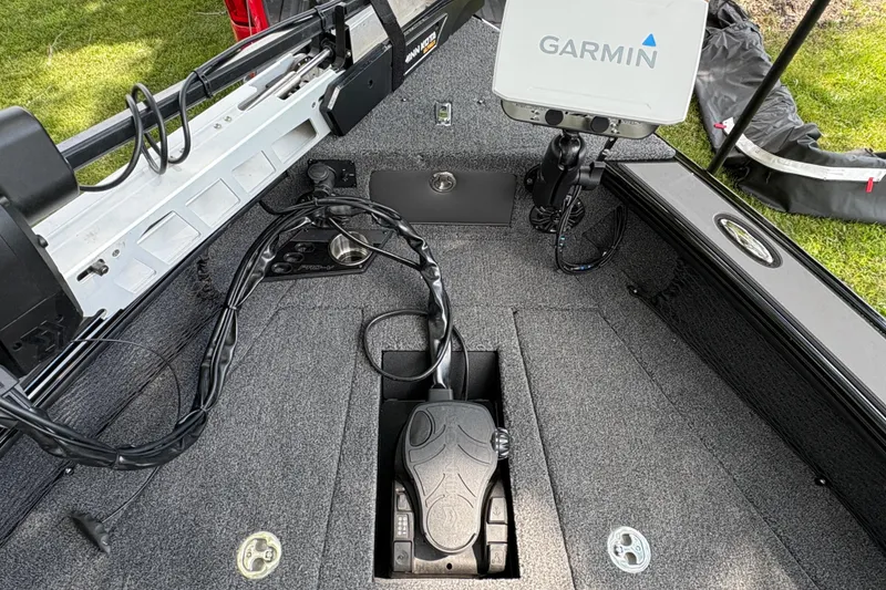 Slide: The Image of 2026 Lund 2075 Pro-V Sport boat deck with Garmin electronics and trolling motor setup. - 8