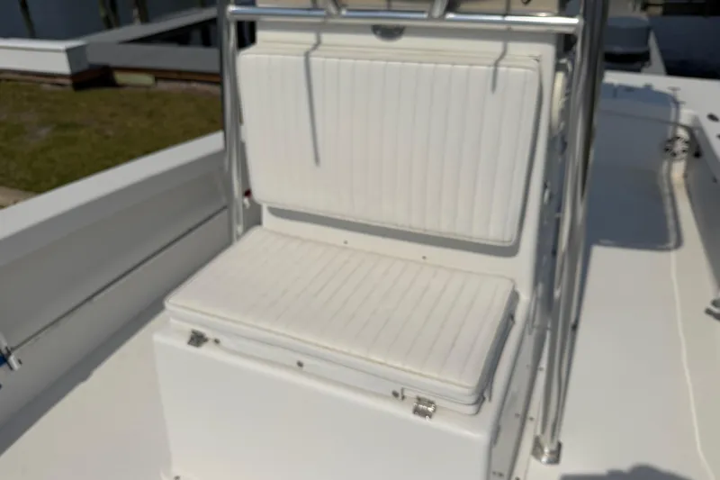Slide: The Image of White seating area on a 2021 Intruder 23 boat, featuring sleek design and metal frame. - 14