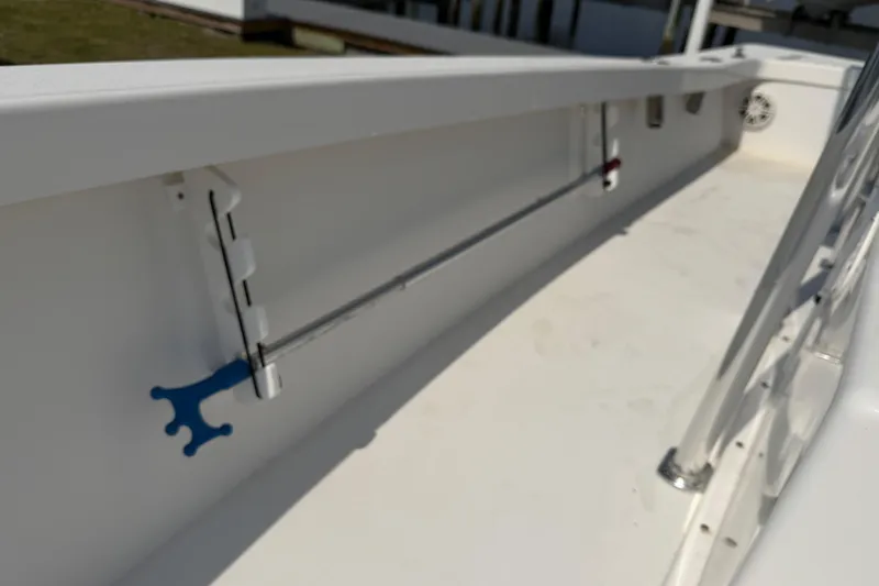 Slide: The Image of Interior view of a 2021 Intruder 23 boat, showcasing sleek white design and fittings. - 15