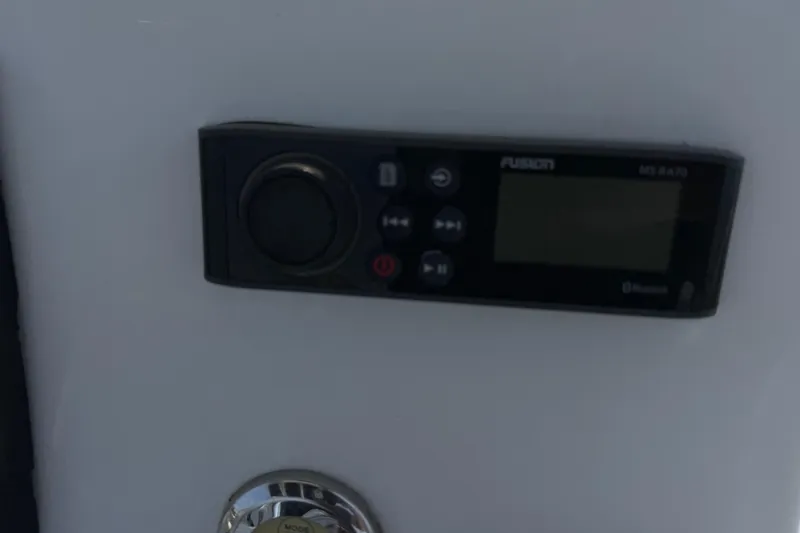 Slide: The Image of Fusion marine stereo system on a 2021 Intruder 23 boat dashboard. - 22
