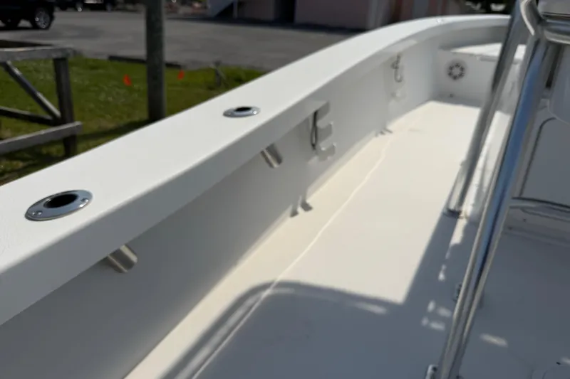 Slide: The Image of 2021 Intruder 23 boat deck with rod holders and stainless steel fittings. - 28
