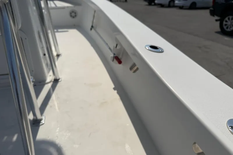 Slide: The Image of 2021 Intruder 23 boat deck with stainless steel fittings and clean white surface. - 29
