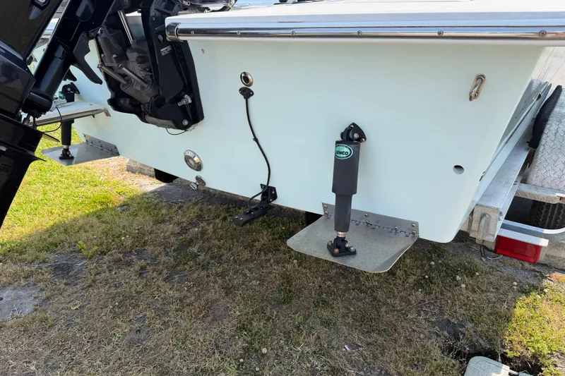 Slide: The Image of Rear view of 2021 Intruder 23 boat with motor and trim tab on trailer. - 30