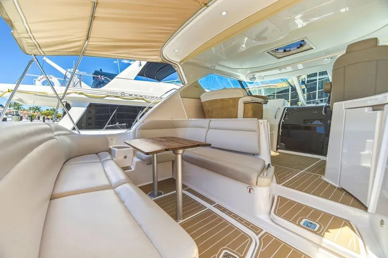 Slide: The Image of Luxurious interior of 2008 Tiara Yachts 3900 Sovran with plush seating and wooden table. - 19