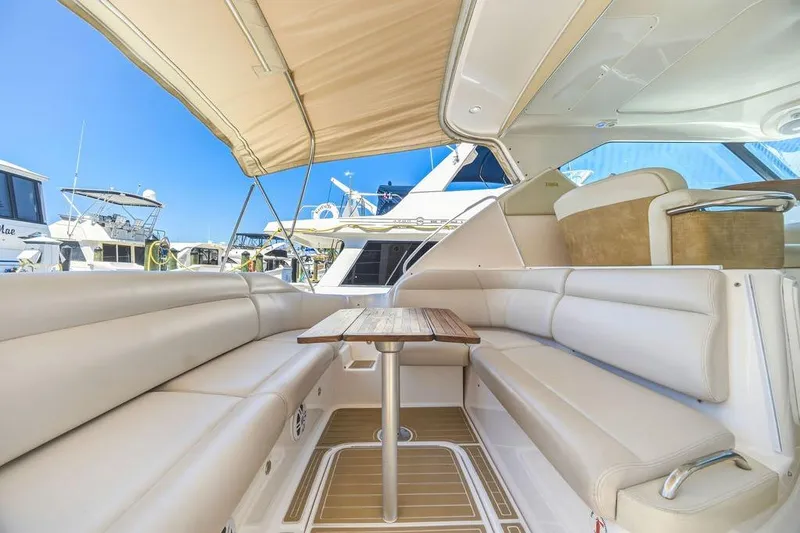 Slide: The Image of Luxurious interior of 2008 Tiara Yachts 3900 Sovran with plush seating and wooden table. - 20