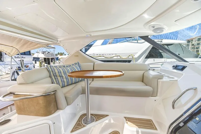 Slide: The Image of Luxurious interior of 2008 Tiara Yachts 3900 Sovran with plush seating and wooden table. - 21
