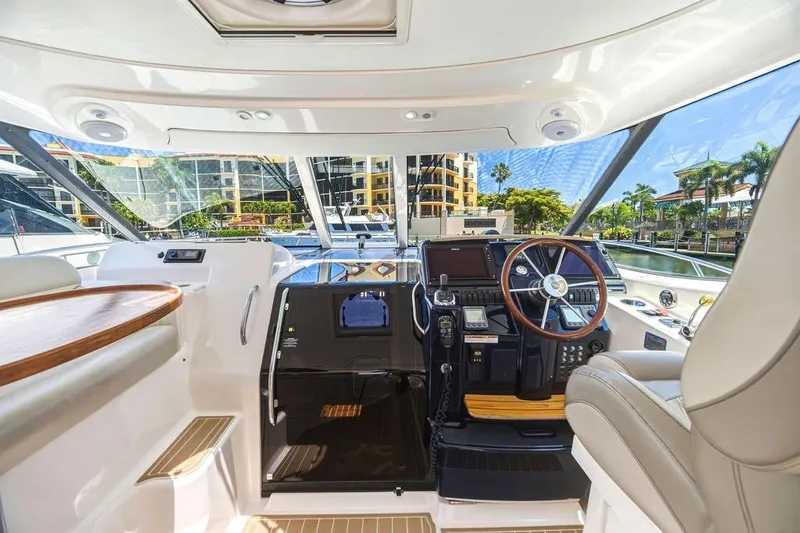 Slide: The Image of Interior view of 2008 Tiara Yachts 3900 Sovran helm with modern controls and luxurious seating. - 23