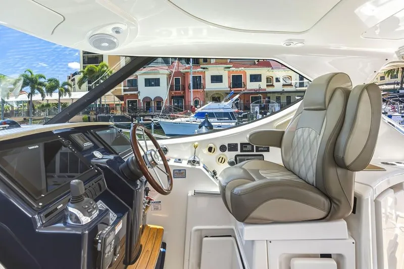 Slide: The Image of Interior cockpit of 2008 Tiara Yachts 3900 Sovran with luxurious seating and controls. - 24