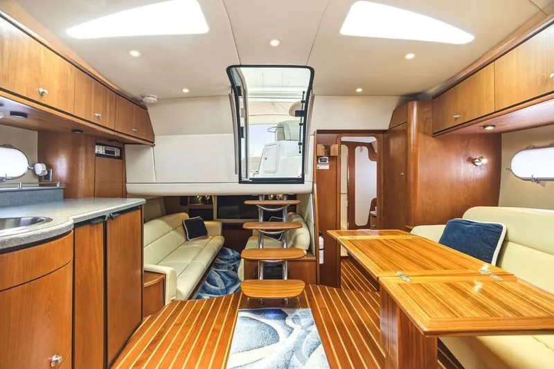 Slide: The Image of Luxurious interior of 2008 Tiara Yachts 3900 Sovran with elegant wood finishes and seating. - 31