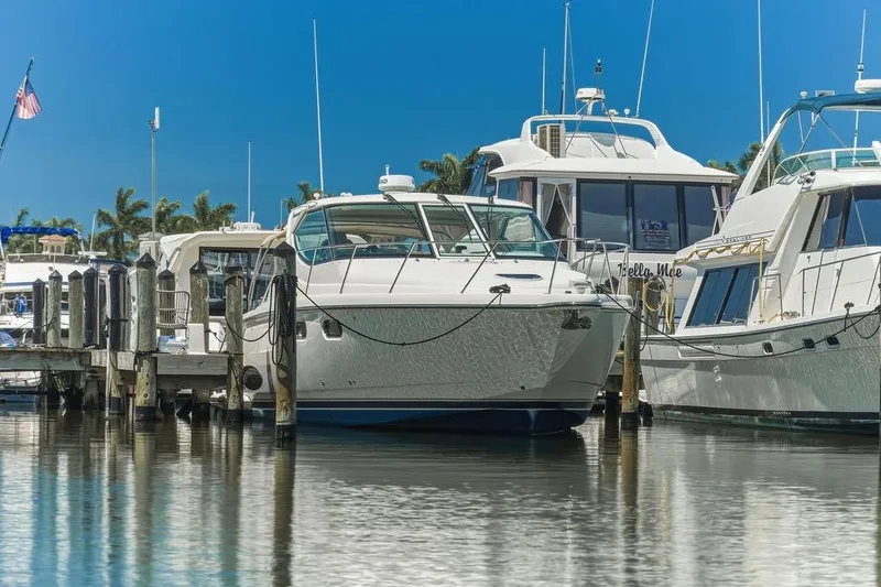 Slide: The Image of 2008 Tiara Yachts 3900 Sovran docked at marina, surrounded by other boats. - 5