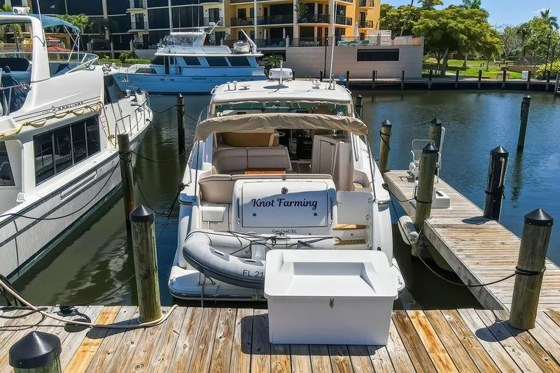 Slide: The Image of 2008 Tiara Yachts 3900 Sovran docked at marina, sunny day, luxury boat. - 8