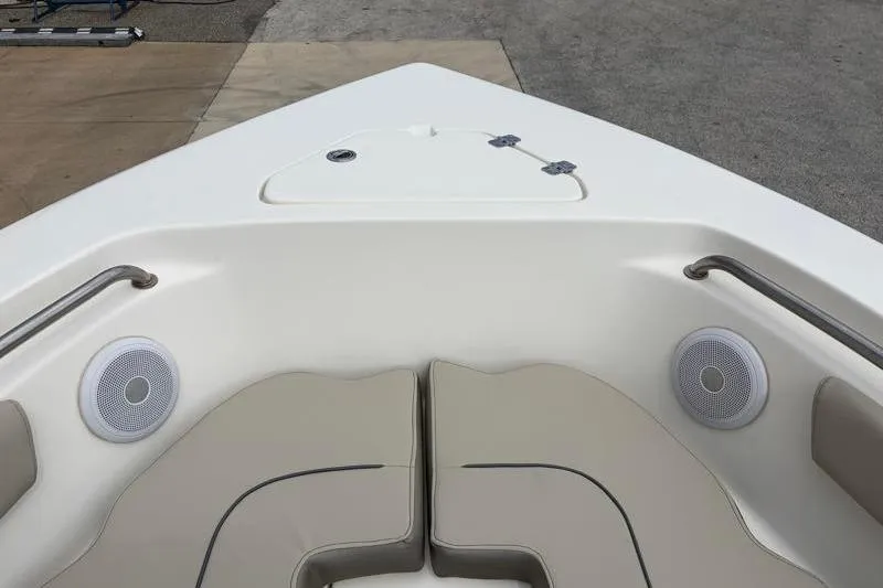 Slide: The Image of Bow seating area of 2023 Key West 203 FS boat with speakers and storage hatch. - 15