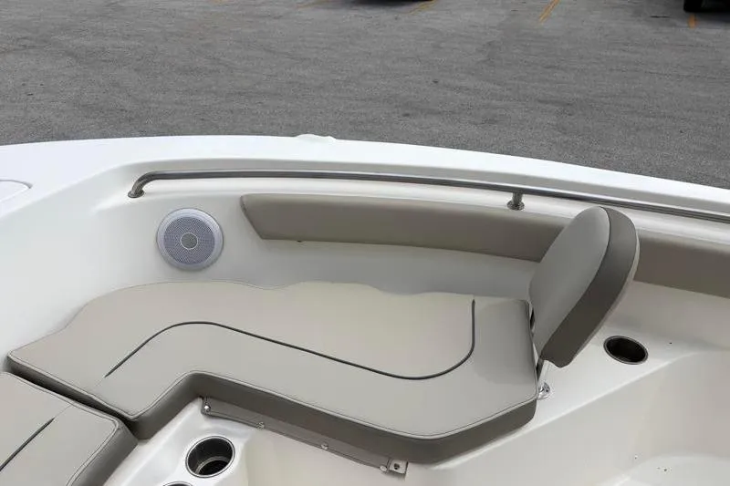 Slide: The Image of 2023 Key West 203 FS boat interior with cushioned seating and speaker. - 16