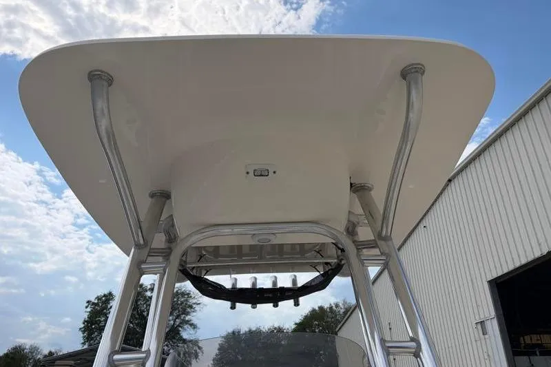 Slide: The Image of 2023 Key West 203 FS boat T-top against a blue sky background. - 19