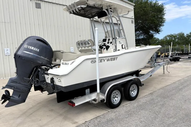 Slide: The Image of 2023 Key West 203 FS boat on trailer with Yamaha outboard motor. - 2