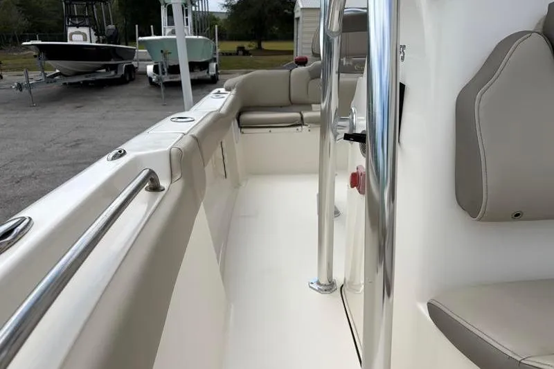 Slide: The Image of 2023 Key West 203 FS boat interior with seating and polished metal details. - 20