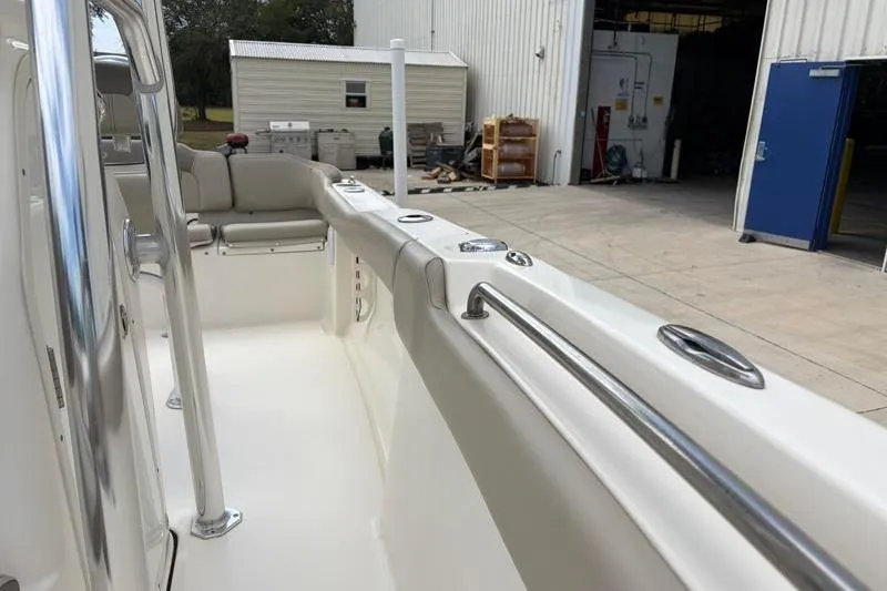 Slide: The Image of 2023 Key West 203 FS boat interior with seating and stainless steel railings. - 21