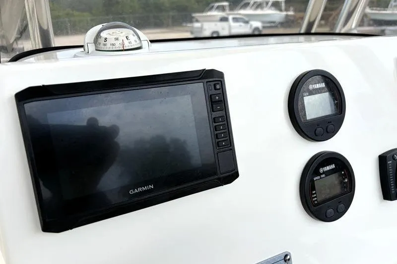 Slide: The Image of Dashboard of 2023 Key West 203 FS boat with Garmin and Yamaha displays. - 26