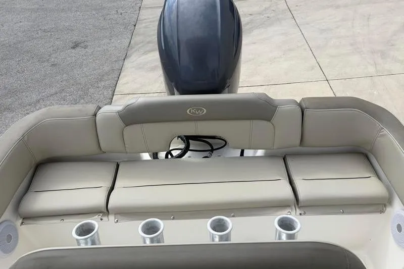 Slide: The Image of 2023 Key West 203 FS boat interior with cushioned seating and rod holders. - 33