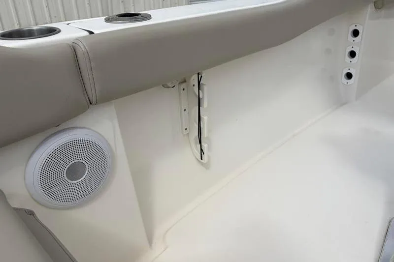 Slide: The Image of 2023 Key West 203 FS boat interior with speaker and cup holders. - 37