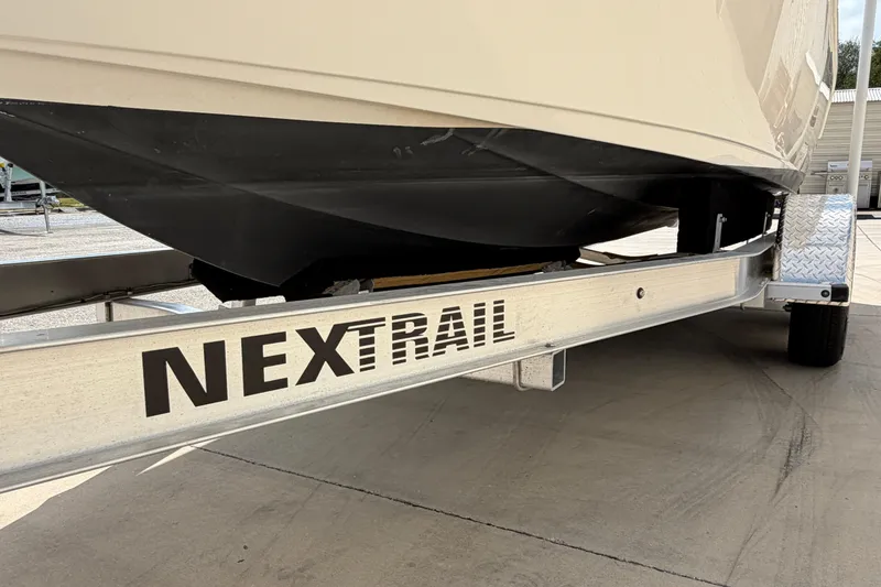 Slide: The Image of 2023 Key West 203 FS boat on NexTrail trailer, close-up view. - 41