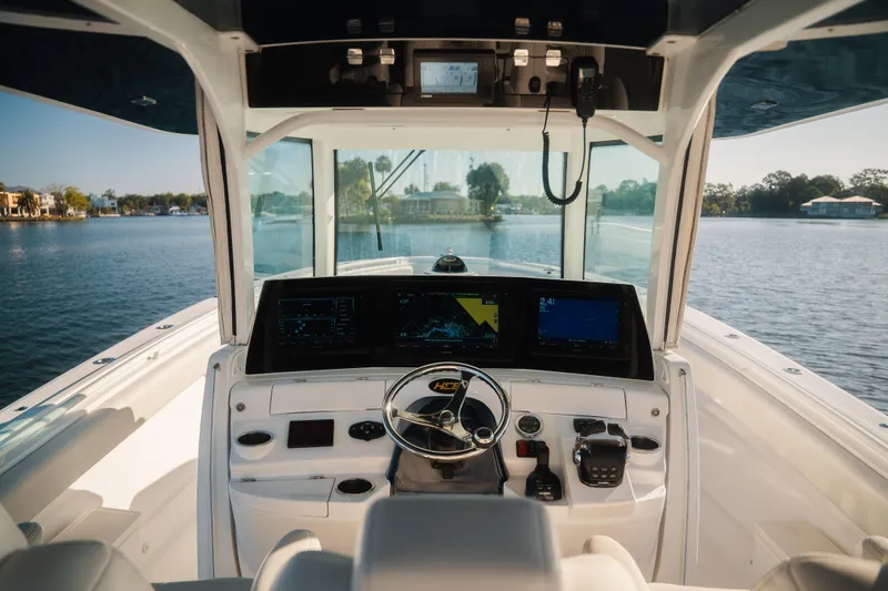 Slide: The Image of Cockpit view of 2019 HCB 42 Siesta boat with advanced navigation systems. - 14