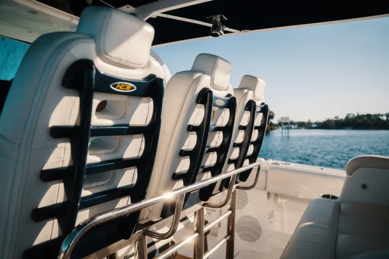 Slide: The Image of Luxury seating on 2019 HCB 42 Siesta boat with scenic water view. - 17