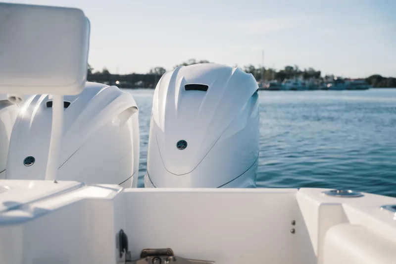 Slide: The Image of 2019 HCB 42 Siesta boat engines on calm water background. - 24