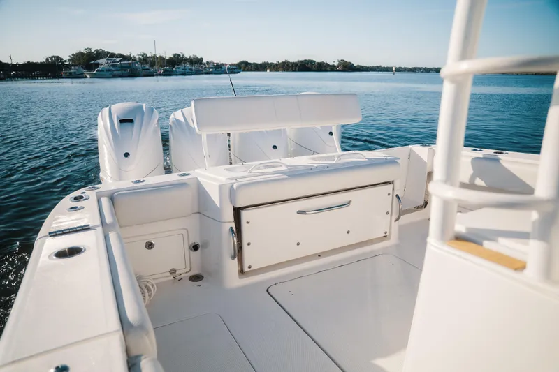 Slide: The Image of 2019 HCB 42 Siesta boat with triple engines on calm water. - 25