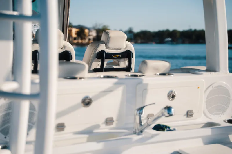 Slide: The Image of 2019 HCB 42 Siesta boat interior with luxurious seating and water view. - 27
