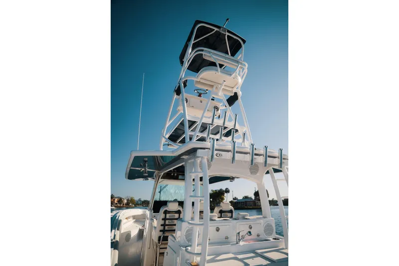 Slide: The Image of 2019 HCB 42 Siesta boat with elevated tower against clear blue sky. - 35