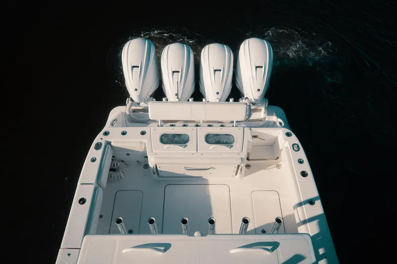 Slide: The Image of Overhead view of 2019 HCB 42 Siesta boat with four powerful outboard engines. - 37