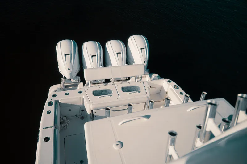 Slide: The Image of 2019 HCB 42 Siesta boat with four powerful outboard engines, viewed from above. - 40