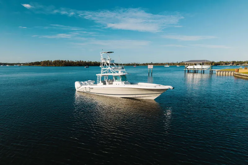 Slide: The Image of 2019 HCB 42 Siesta boat on calm water under clear blue sky. - 41