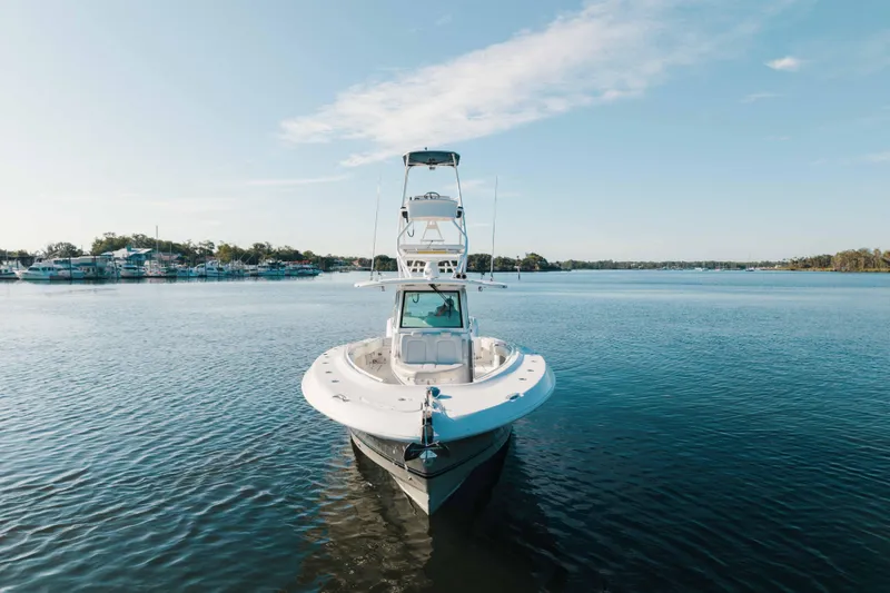 Slide: The Image of 2019 HCB 42 Siesta boat on calm water under clear blue sky. - 43