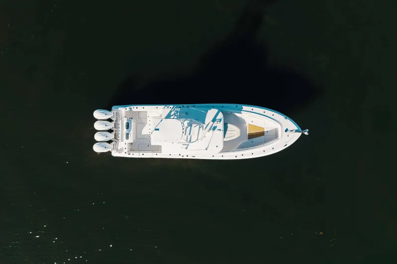 Slide: The Image of Aerial view of 2019 HCB 42 Siesta boat on dark water. - 44