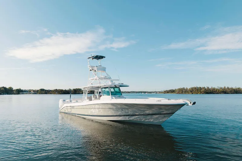 Slide: The Image of 2019 HCB 42 Siesta boat on calm water under clear blue sky. - 45