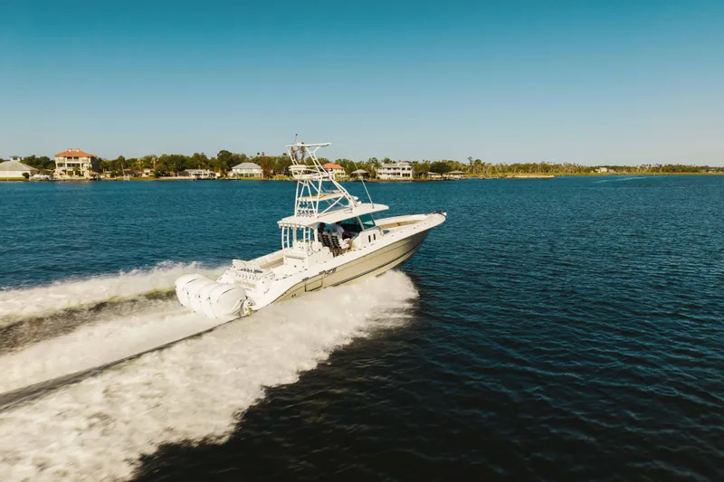 Slide: The Image of 2019 HCB 42 Siesta boat cruising on a sunny day in a scenic waterway. - 47