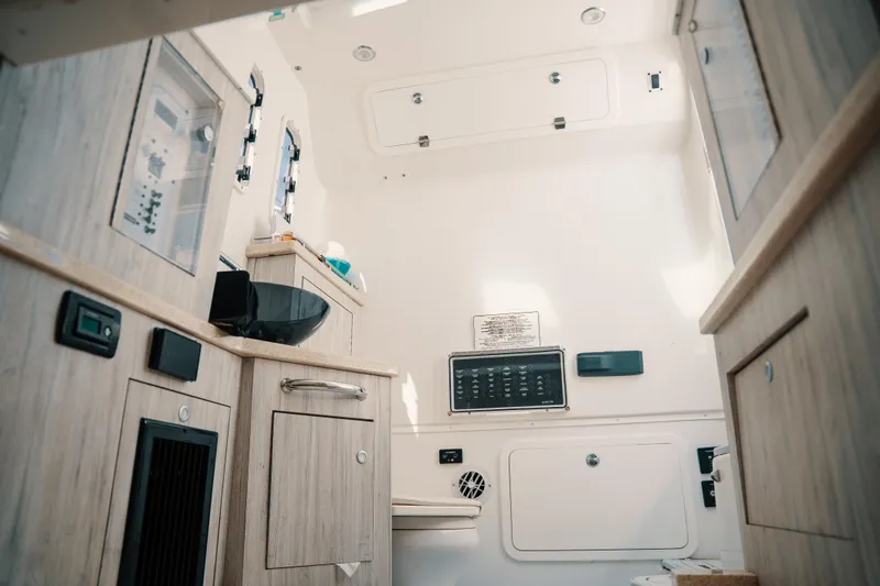 Slide: The Image of Interior of 2019 HCB 42 Siesta boat, featuring modern cabinetry and control panels. - 7