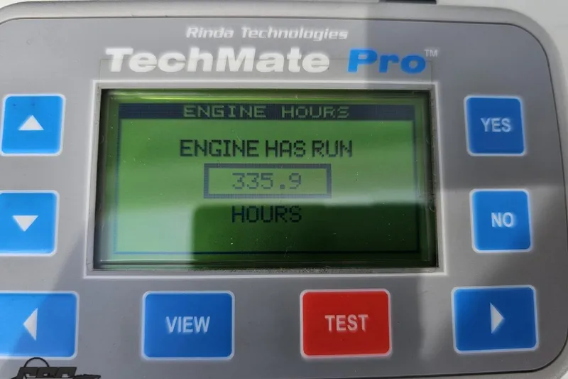 Slide: The Image of TechMate Pro display showing 335.9 engine hours for 1999 Baja 272 model. - 102