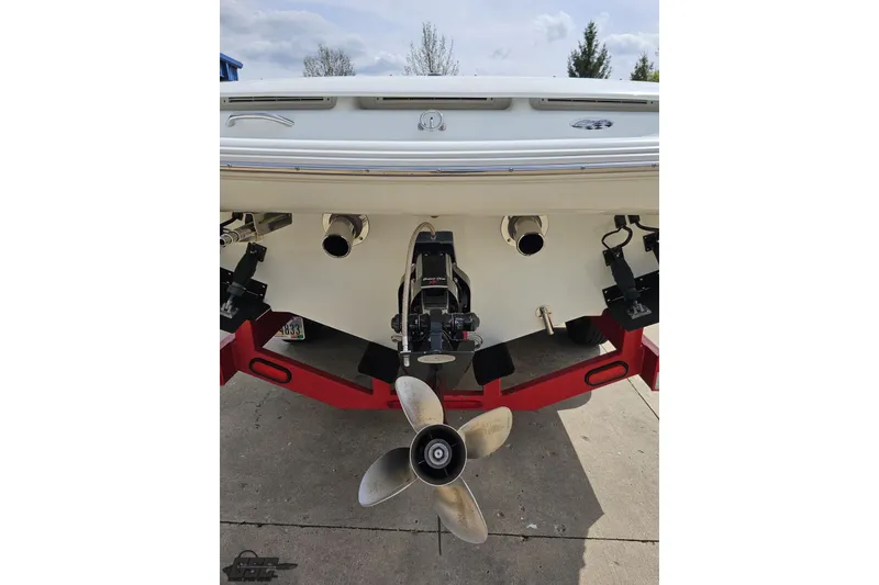 Slide: The Image of Rear view of a 1999 Baja 272 boat with visible propeller and exhaust. - 32