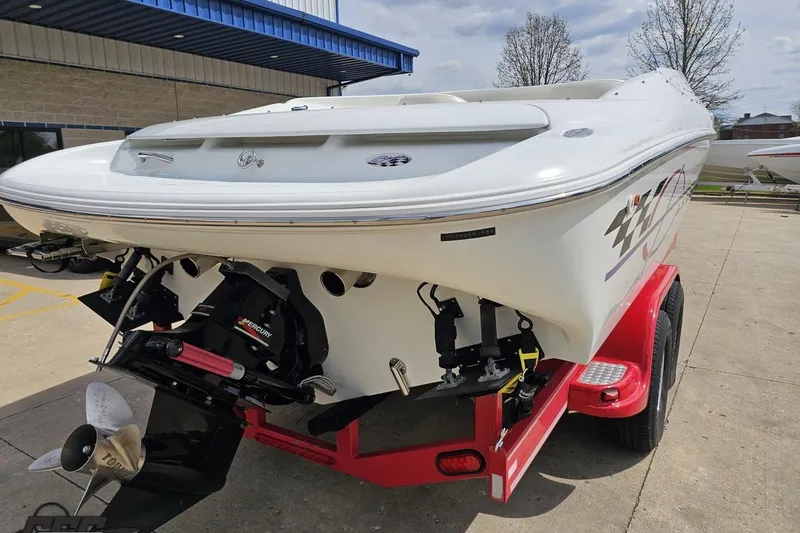 Slide: The Image of 1999 Baja 272 boat on red trailer, rear view showing Mercury engine. - 33