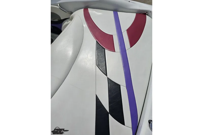 Slide: The Image of 1999 Baja 272 boat interior with colorful, geometric upholstery design. - 43