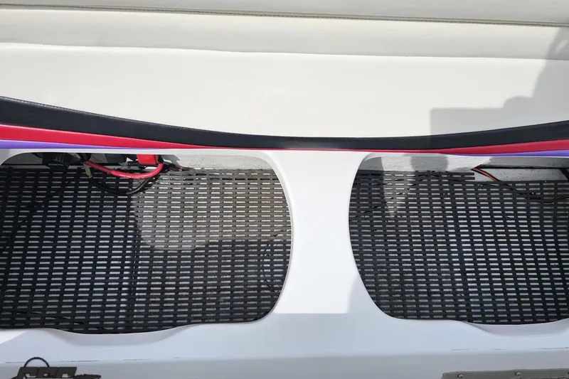 Slide: The Image of Interior view of a 1999 Baja 272 boat, featuring a textured floor and sleek design. - 87