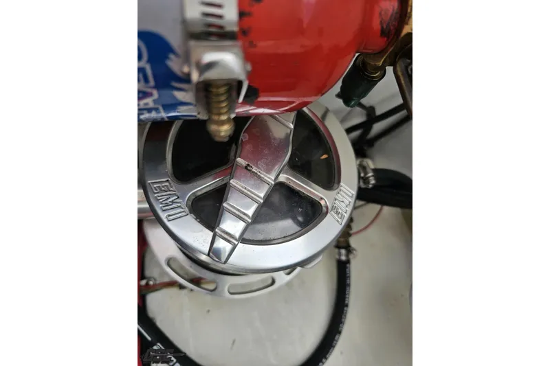 Slide: The Image of Close-up of a 1999 Baja 272 engine component with EMI branding. - 98