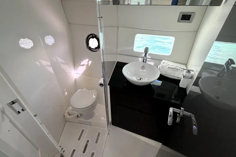 Slide: The Image of Luxurious bathroom interior of 2024 Schaefer 400 yacht with modern fixtures and ocean view. - 17